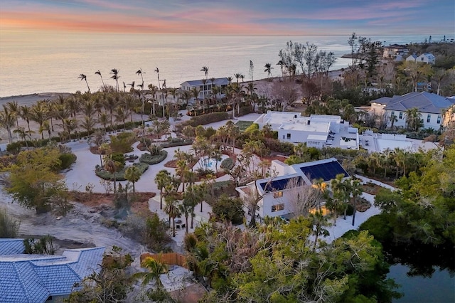 aerial view at dusk with a water view