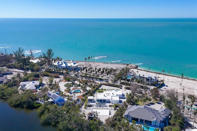 aerial view with a view of the beach and a water view