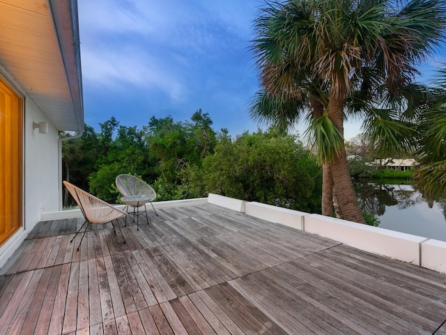 wooden deck featuring a water view