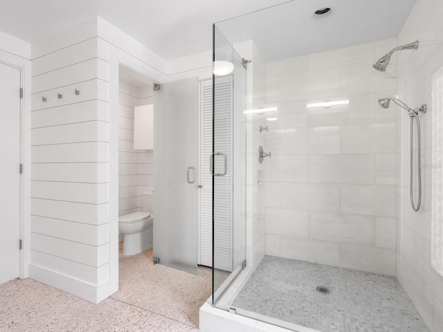 7665 Sanderling Rd, Sarasota, FL 34242 - bathroom featuring a stall shower, speckle patterned floor, and a closet