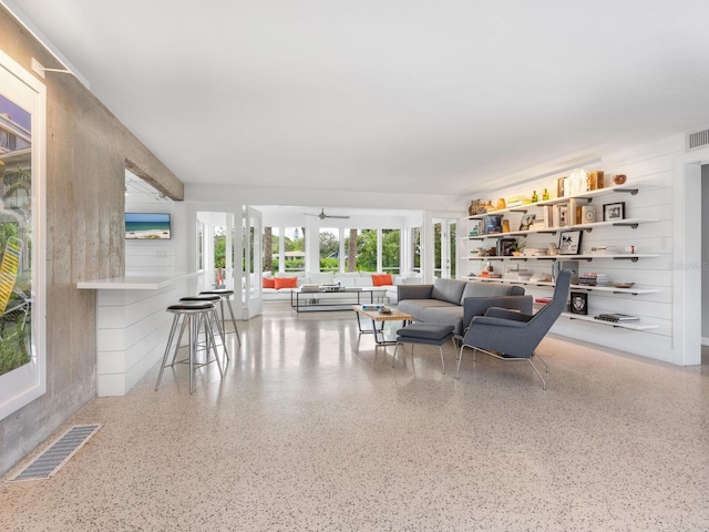 7665 Sanderling Rd, Sarasota, FL 34242 - living area featuring speckled floor and ceiling fan