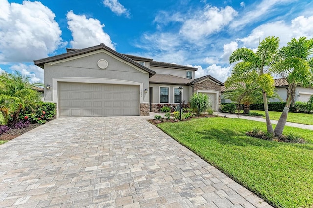 view of front facade featuring a garage and a front yard