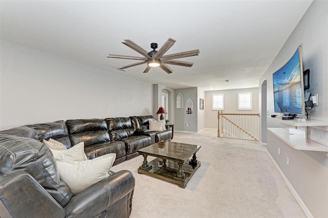 living room featuring carpet flooring and ceiling fan