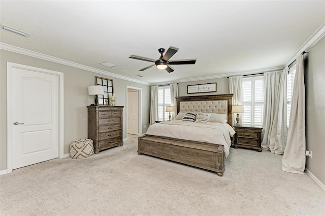 bedroom featuring light carpet, crown molding, and ceiling fan