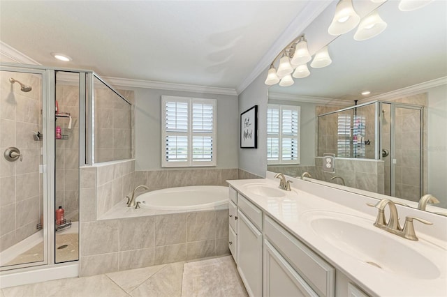 bathroom with plus walk in shower, tile patterned flooring, crown molding, a chandelier, and vanity