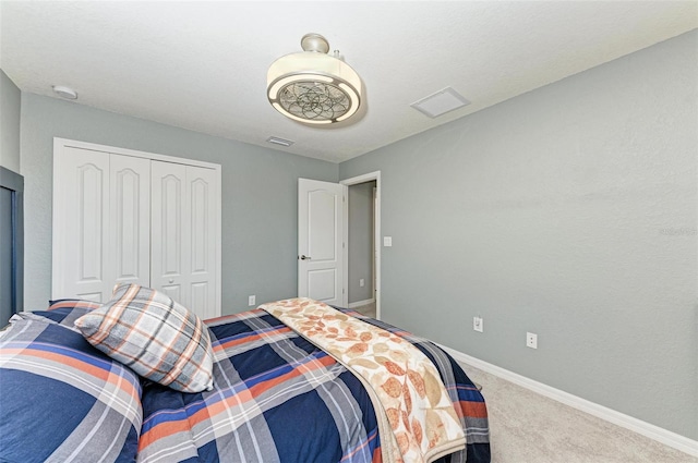 bedroom featuring a closet and carpet floors