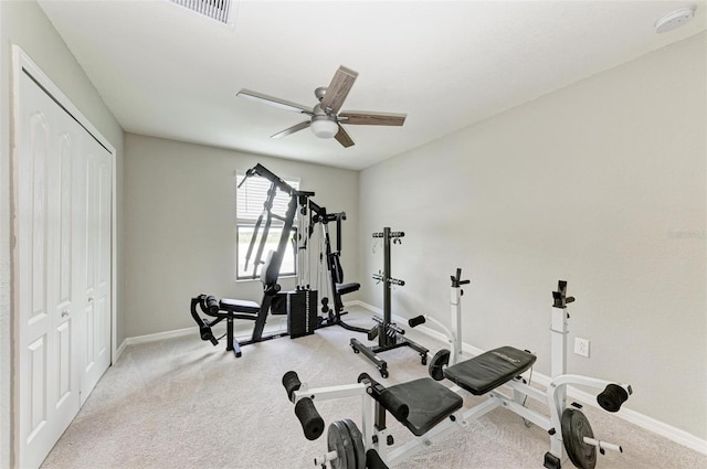 exercise area with light carpet and ceiling fan