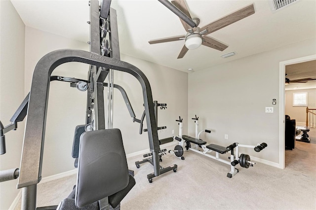 exercise area with ceiling fan and carpet floors