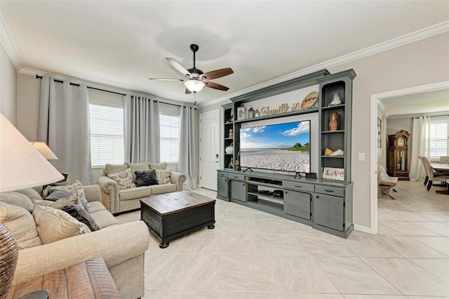 living room with crown molding, ceiling fan, and light tile patterned floors