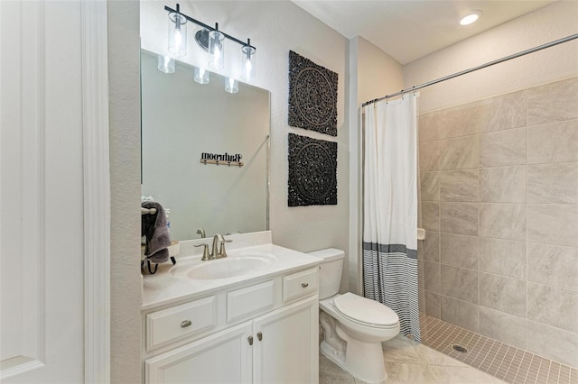 bathroom with vanity, toilet, curtained shower, and tile patterned flooring