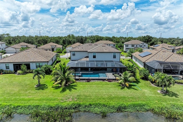 birds eye view of property with a water view