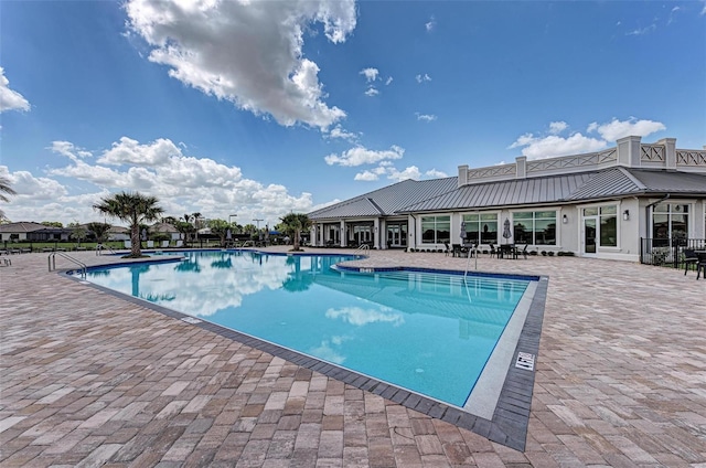 view of swimming pool with a patio