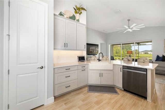 kitchen featuring dishwasher, light hardwood / wood-style flooring, kitchen peninsula, sink, and ceiling fan