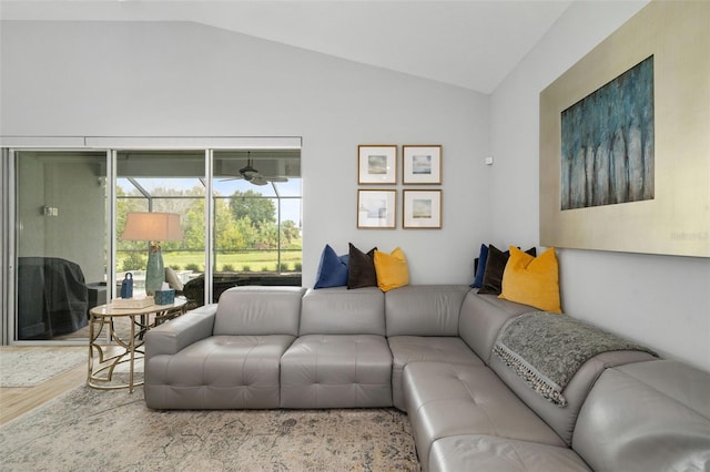 living room with lofted ceiling and light hardwood / wood-style flooring