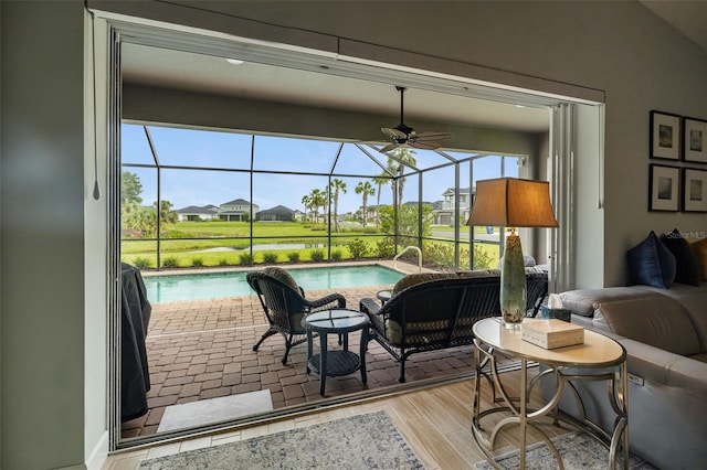 interior space with vaulted ceiling, ceiling fan, and a pool