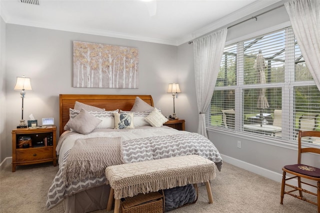 bedroom featuring ceiling fan, light carpet, and ornamental molding