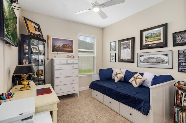 bedroom with ceiling fan and light colored carpet