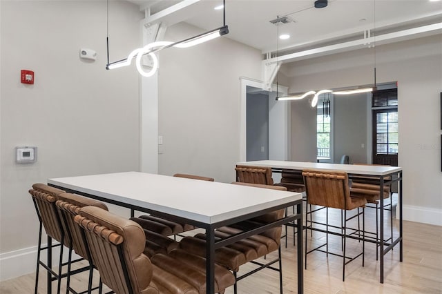 dining space with light wood-type flooring