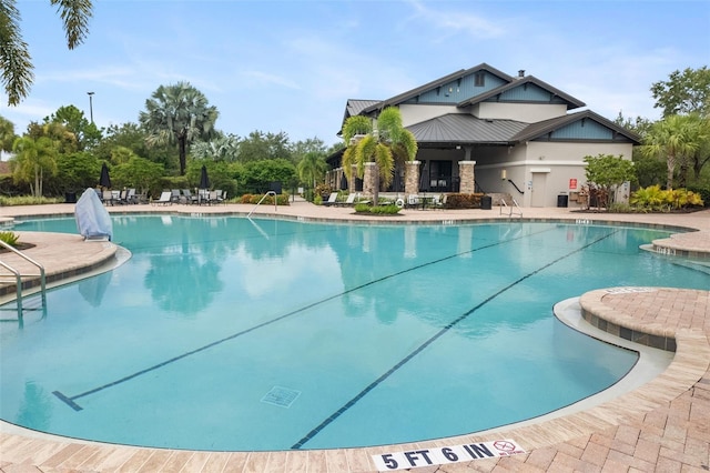 view of swimming pool with a patio area