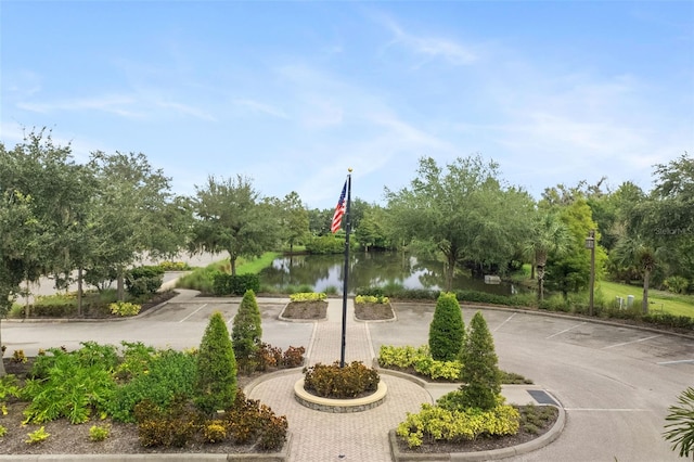 surrounding community featuring a water view