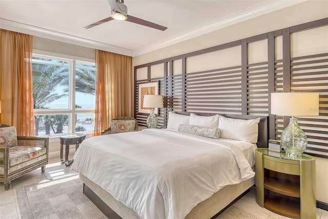 tiled bedroom with multiple windows, ceiling fan, and ornamental molding