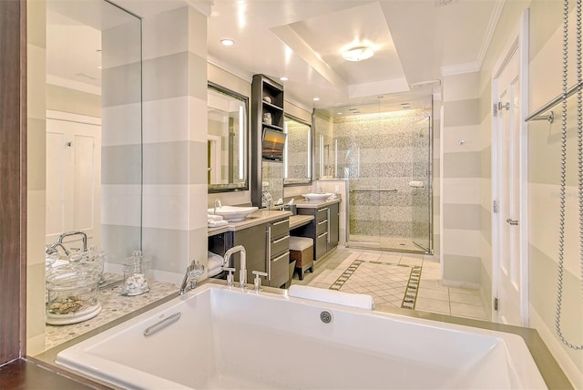 bathroom with vanity, separate shower and tub, a tray ceiling, ornamental molding, and tile patterned floors