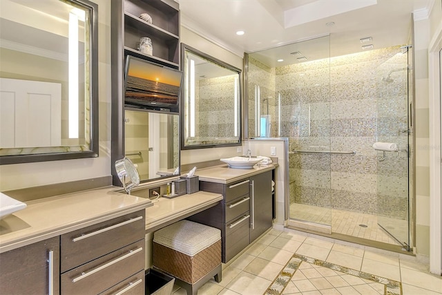 bathroom featuring tile patterned flooring, a shower with door, ornamental molding, and vanity