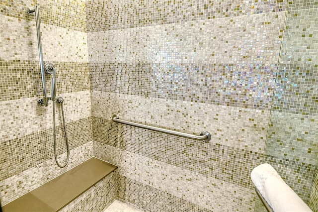 bathroom with a tile shower