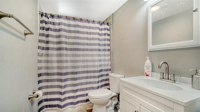 bathroom featuring a shower with curtain, toilet, and vanity