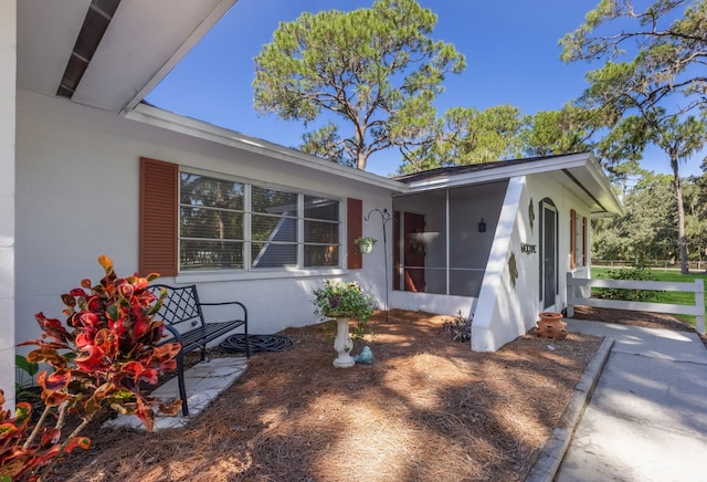 exterior space with a sunroom