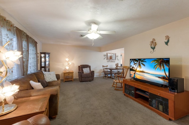 living room with carpet floors and ceiling fan