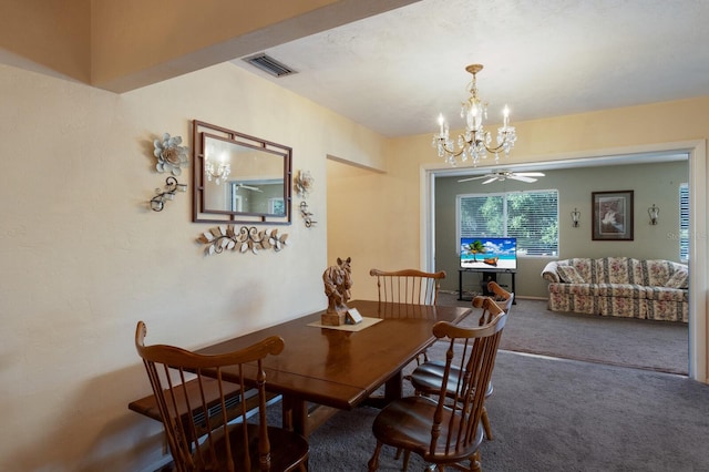 dining space featuring ceiling fan with notable chandelier and carpet floors