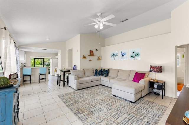 living room with high vaulted ceiling, ceiling fan, and light tile patterned floors