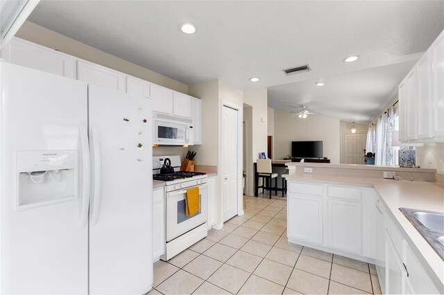 kitchen with white cabinets, white appliances, light tile patterned flooring, and ceiling fan