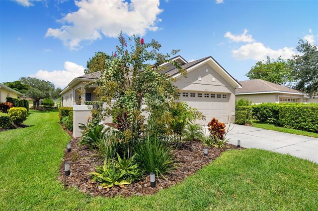 view of front of house featuring a garage and a front yard