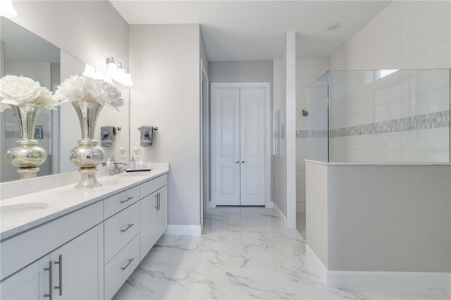 bathroom featuring vanity and a tile shower