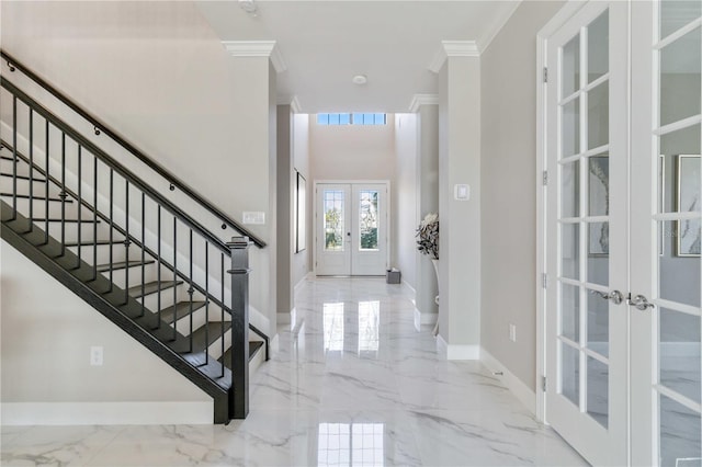 entrance foyer featuring french doors and ornamental molding