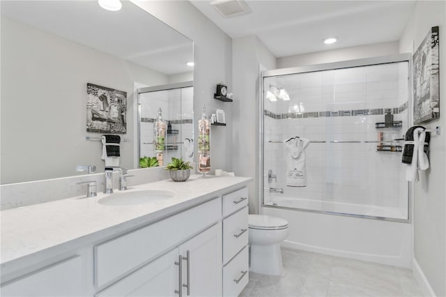 full bathroom with combined bath / shower with glass door, vanity, toilet, and tile patterned flooring