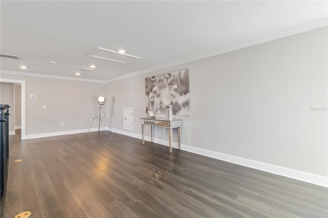 spare room with dark hardwood / wood-style floors and ornamental molding