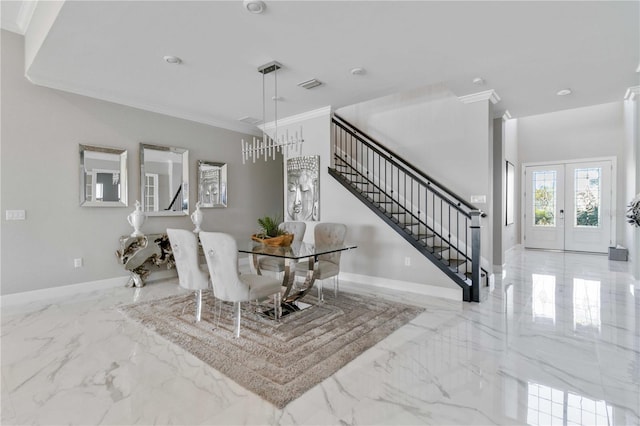 dining room featuring crown molding and french doors