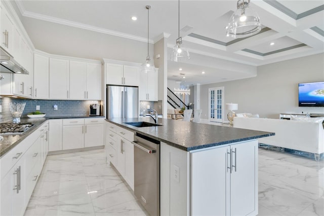 kitchen featuring white cabinetry, sink, coffered ceiling, a kitchen island with sink, and appliances with stainless steel finishes