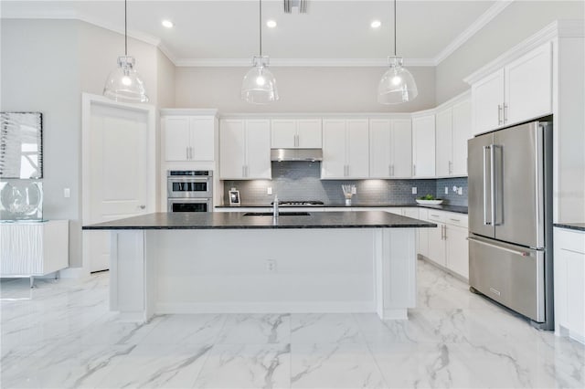 kitchen featuring white cabinets, a center island with sink, hanging light fixtures, and appliances with stainless steel finishes