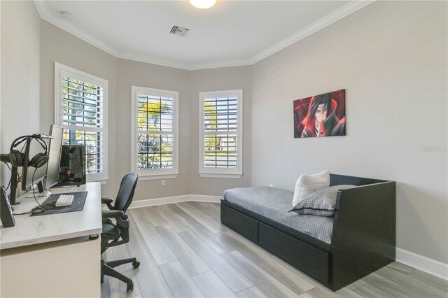 office featuring light wood-type flooring and ornamental molding