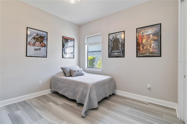 bedroom with light wood-type flooring