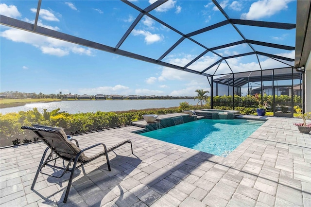 view of swimming pool with glass enclosure, an in ground hot tub, a patio area, and a water view