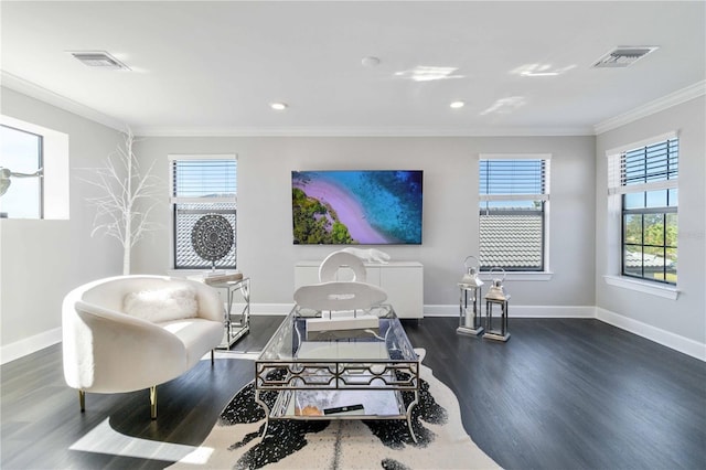 living room featuring dark hardwood / wood-style flooring and crown molding