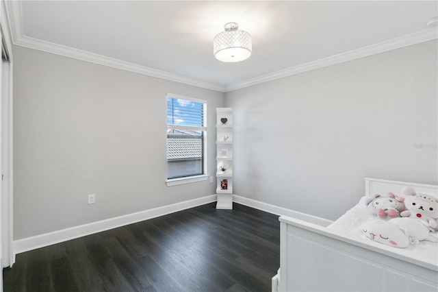 unfurnished bedroom featuring dark hardwood / wood-style floors and crown molding