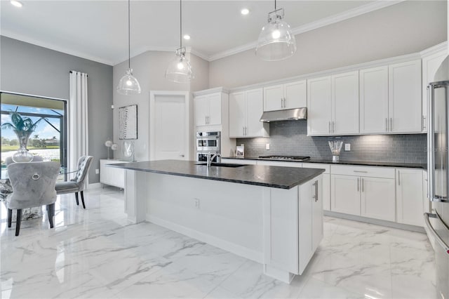 kitchen with white cabinets, sink, an island with sink, decorative light fixtures, and stainless steel appliances