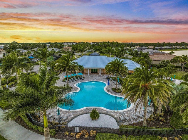 view of pool at dusk