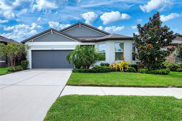 view of front of house featuring a garage and a front lawn